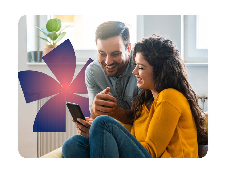 Man and woman looking at phone and smiling