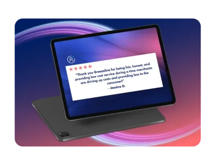 Tablet displaying a 5-star review from Jessica D. thanking Breezeline for fair, honest, low-cost service.